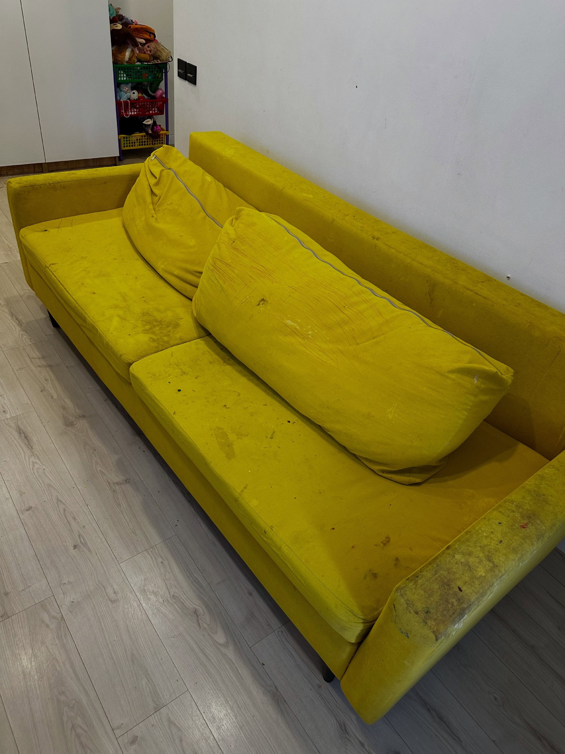 Yellow sofa before cleaning