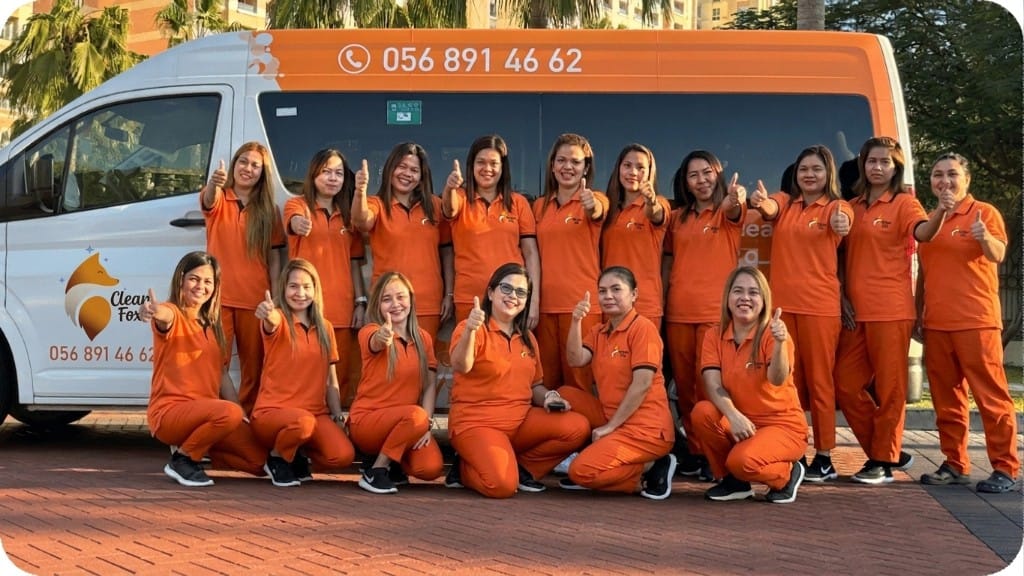 Clean Fox team in orange uniforms with the branded van in Dubai